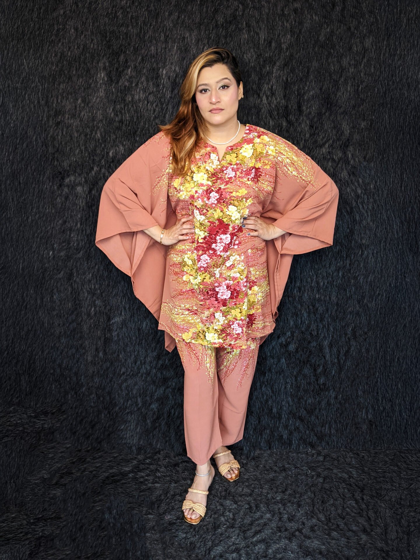 Bangladeshi woman wearing a stylish mustard floral printed kameez co-ord set, standing at the center in a studio setup for Pineapple BD fashion catalog
